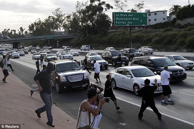 Dangerous: Los Angeles demonstrators began to block traffic on the Interstate 10 freeway while protesting the acquittal of George Zimmerman Sunday Read more: http://www.dailymail.co.uk/news/article-2362973/Protests-erupt-coast-coast-George-Zimmerman-goes-FREE-Second-day-demonstrations-planned-night-anger.html#ixzz2ZBMWwtmQ